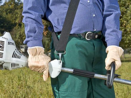 : Always hold the brushcutter with both hands. Your left hand should be on the loop handle and your right on the shaft handle.