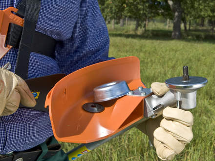 : Step 1 of 6: Preparing your brushcutterPlease make certain that the correct, approved guard for the cutting attachment is installed. Hold the brushcutter with the mount for the cutting attachment facing upward. 