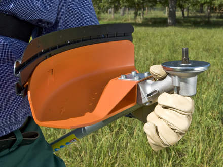 : Step 1 of 5: Preparing your brushcutterPlease make certain that the correct, approved guard for the cutting attachment is installed. Hold the brushcutter with the mount for the cutting attachment facing upward. 